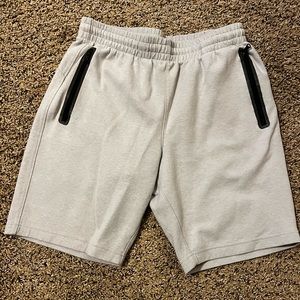 Grey athletic shorts.